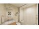 Clean bathroom with tub and leaf patterned wallpaper at 5120 Marina Way # 31408, Tampa, FL 33611