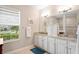 Elegant bathroom with double vanity and granite countertop at 5149 Jennings Trl, Brooksville, FL 34601