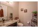 Neutral powder room features a granite counter and decorative wall art at 5149 Jennings Trl, Brooksville, FL 34601