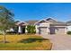 Two-story house with a two-car garage and manicured lawn at 5149 Jennings Trl, Brooksville, FL 34601