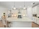 Modern kitchen featuring a large island and white cabinets at 5149 Jennings Trl, Brooksville, FL 34601