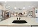 Kitchen island with a sink and a view into the living room at 5149 Jennings Trl, Brooksville, FL 34601