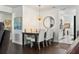 Dining area with modern chandelier and seating for four at 5267 81St N St # 12, St Petersburg, FL 33709