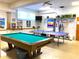 Game room featuring a pool table, ping pong, and weight equipment at 5267 81St N St # 12, St Petersburg, FL 33709