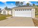 Two-car garage with automatic door opener, adding convenience to the property at 6119 Freeport Dr, Spring Hill, FL 34606