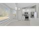 Modern kitchen with white cabinets and stainless steel appliances at 6119 Freeport Dr, Spring Hill, FL 34606