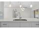 Kitchen island with quartz countertop and stainless steel sink at 6119 Freeport Dr, Spring Hill, FL 34606