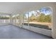 Screened porch with view of backyard at 6119 Freeport Dr, Spring Hill, FL 34606