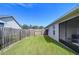 Fenced backyard with gate and patio at 6932 Oakcrest Way, Zephyrhills, FL 33542