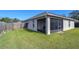 Large backyard with screened porch and fenced enclosure at 6932 Oakcrest Way, Zephyrhills, FL 33542