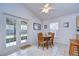 Cozy dining area with wood table and chairs, adjacent to the kitchen at 6932 Oakcrest Way, Zephyrhills, FL 33542