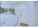 Laundry room with washer, dryer and storage at 6932 Oakcrest Way, Zephyrhills, FL 33542