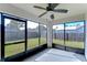 Spacious screened porch with ceiling fan at 6932 Oakcrest Way, Zephyrhills, FL 33542