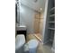 Bathroom with shower, toilet and shelving at 6985 82Nd N Ave, Pinellas Park, FL 33781