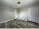 Bedroom with wood-look floors and mirrored closet doors at 6985 82Nd N Ave, Pinellas Park, FL 33781