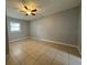 Bedroom with tile floors and ceiling fan at 6985 82Nd N Ave, Pinellas Park, FL 33781