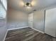 Bright bedroom with wood-look floors and neutral walls at 6985 82Nd N Ave, Pinellas Park, FL 33781