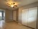 Bedroom with tile floors, ceiling fan, and built-in closet at 6985 82Nd N Ave, Pinellas Park, FL 33781