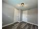 Bedroom with gray walls, wood-look floors, and double closets at 6985 82Nd N Ave, Pinellas Park, FL 33781