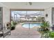 Inviting kidney-shaped pool with screened enclosure at 7051 Nova Scotia Dr, Port Richey, FL 34668