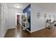 Bright hallway with wood floors and decorative accents at 7304 Gates Cir, Spring Hill, FL 34606