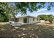 House exterior showcasing a backyard patio and screened porch at 7304 Gates Cir, Spring Hill, FL 34606