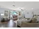 Living room featuring hardwood floors, fireplace, and ample natural light at 7304 Gates Cir, Spring Hill, FL 34606