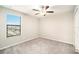 Bright bedroom with ceiling fan and window coverings at 7610 Blue Iris Ln, Tampa, FL 33619