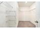 Large walk-in closet with wire shelving at 7610 Blue Iris Ln, Tampa, FL 33619