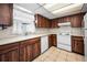 Kitchen features wood cabinets and white appliances at 8001 70Th N St, Pinellas Park, FL 33781