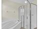 Clean bathroom featuring a shower and garden tub at 8243 47Th Street E Cir, Palmetto, FL 34221