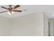 Large bedroom with ceiling fan and access to other rooms at 8243 47Th Street E Cir, Palmetto, FL 34221