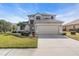 Two-story house with a two-car garage and well-maintained lawn at 8243 47Th Street E Cir, Palmetto, FL 34221