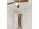 Bedroom with ceiling fan and access to another room at 8310 Archwood Cir, Tampa, FL 33615