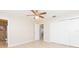 Bedroom with ceiling fan, closet, and bathroom access at 8310 Archwood Cir, Tampa, FL 33615