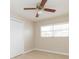 Bright bedroom with ceiling fan, window, and closet at 8310 Archwood Cir, Tampa, FL 33615