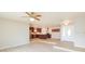 Open living room with kitchen view and light wood floors at 8310 Archwood Cir, Tampa, FL 33615