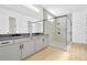 Modern bathroom with gray cabinets and a glass shower at 8421 Golden Beach Ct, Parrish, FL 34219