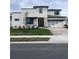 Two-story modern home with a gray roof and light-colored exterior, featuring a three-car garage at 8421 Golden Beach Ct, Parrish, FL 34219