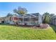 Screened patio with firepit and spacious grassy backyard at 8460 Parkwood Blvd, Seminole, FL 33777