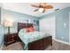 Bedroom with a queen bed, hardwood floors, and ample closet space at 8460 Parkwood Blvd, Seminole, FL 33777