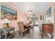 Bright dining room with wood table and chairs, access to a patio at 8460 Parkwood Blvd, Seminole, FL 33777