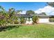 Charming ranch home with lush landscaping and solar panels at 8460 Parkwood Blvd, Seminole, FL 33777