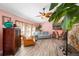 Relaxing living room featuring light floors and a stone fireplace at 8460 Parkwood Blvd, Seminole, FL 33777