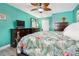 Main bedroom with king-size bed and tropical bedding at 8460 Parkwood Blvd, Seminole, FL 33777