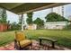 Backyard patio with seating and large lawn at 925 67Th S St, St Petersburg, FL 33707