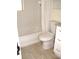 Clean bathroom with white tile and bathtub at 925 67Th S St, St Petersburg, FL 33707