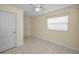 Bedroom features tile flooring, fresh paint, ceiling fan and window at 925 67Th S St, St Petersburg, FL 33707