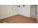 Bedroom features laminated wood floors, fresh paint, ceiling fan and closet at 925 67Th S St, St Petersburg, FL 33707