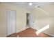 Bedroom features laminated wood floors, fresh paint, ceiling fan and closet at 925 67Th S St, St Petersburg, FL 33707